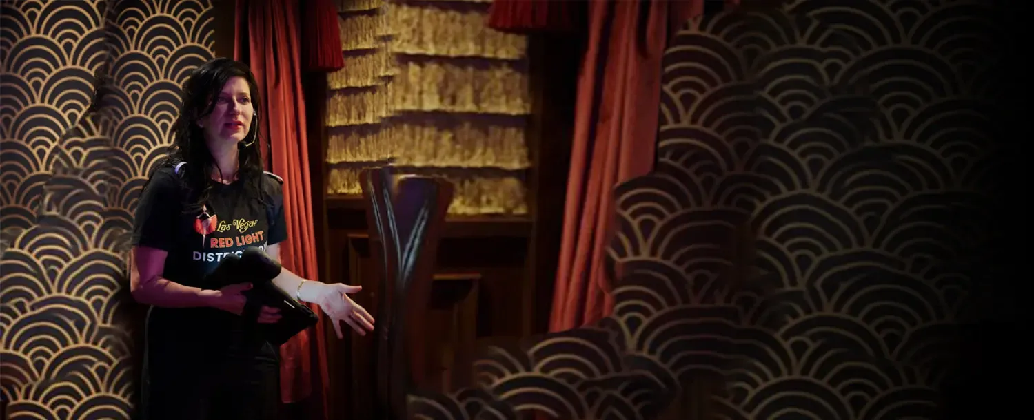 Jami Rodman, the Las Vegas Madam, presenting inside a historic downtown Las Vegas venue